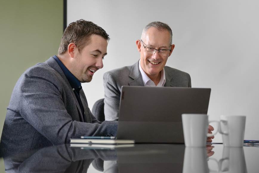 Men looking at a computer screen

AI-generated content may be incorrect.