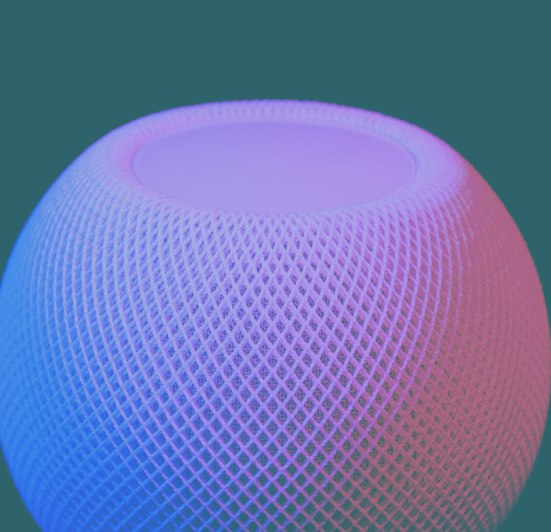 A smart speaker n the centre of the image with a purple and pink light drenched over it